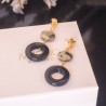 Arete pirita con aro onix